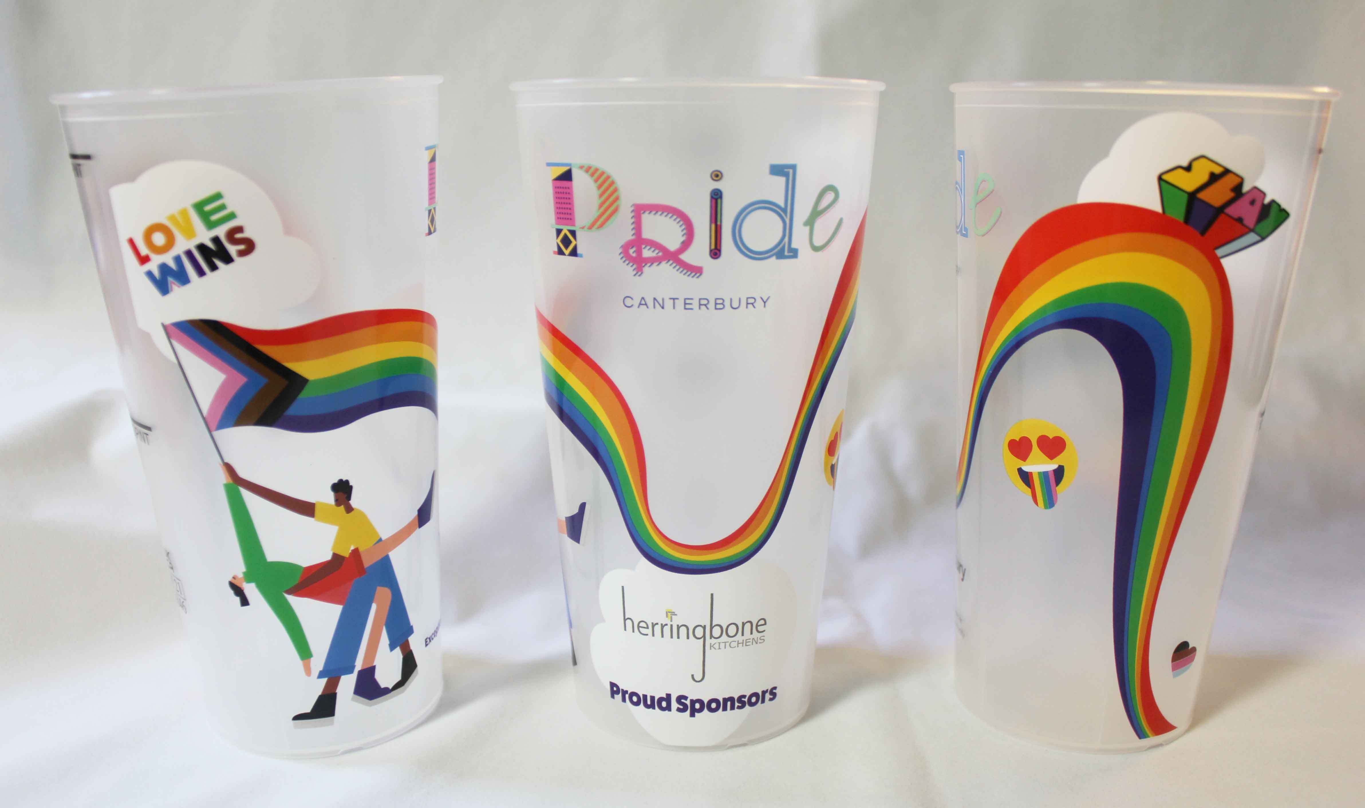 A row of reusable cups with four completed print designs