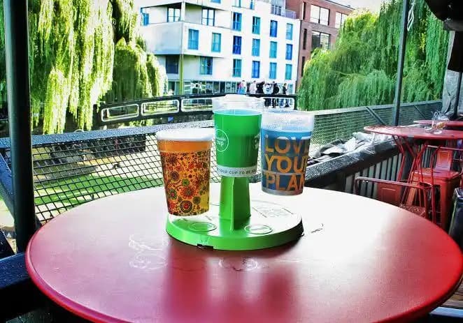 A selection of printed reusable cup designs displayed together